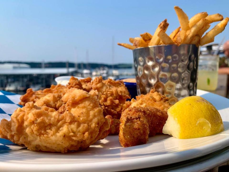 A fried seafood platter at Boathouse 19 is best enjoyed outside, on the scenic deck overlooking the Narrows.