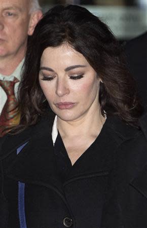 Celebrity chef Nigella Lawson leaves Isleworth Crown Court in west London December 4, 2013. REUTERS/Neil Hall