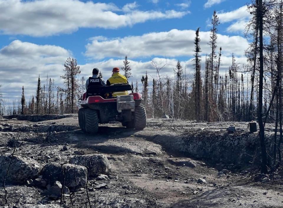 An RCMP officer and a search and rescue member drive out to look for Ralph Beaulieu, who was reported missing on May 9. 