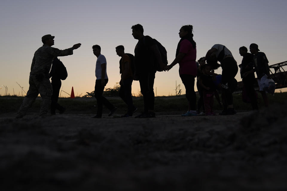 FILE - Migrants who crossed the Rio Grande and entered the U.S. from Mexico are lined up for processing by U.S. Customs and Border Protection, Sept. 23, 2023, in Eagle Pass, Texas. As Congress returns this week, Senate Republicans have made it clear they won’t support additional war aid for Ukraine unless they can pair it with border security measures. (AP Photo/Eric Gay, File)