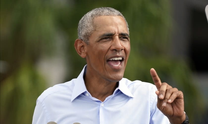 Former President Barack Obama speaks at a rally while campaigning for Democratic presidential candidate former Vice President Joe Biden Tuesday, Oct. 27, 2020, in Orlando, Fla. (AP Photo/John Raoux)