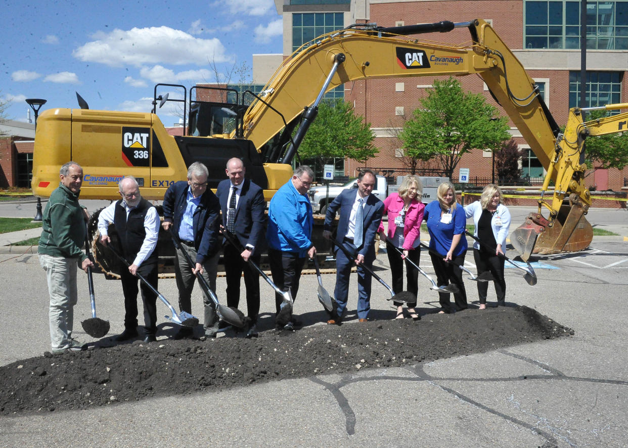 Honorees throw the first shovel of dirt for the new Patient Access Emergency Center at Wooster Community Hospital. The center, connecting a realm of patient care services, is expected to be done in late 2025 or early 2026.