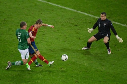 Spanish forward Fernando Torres (C) scores during the Euro 2012 championships football match Spain vs Republic of Ireland at the Gdansk Arena. A double by Fernando Torres inspired defending champions Spain to a 4-0 thrashing of Ireland on Thursday in their Euro 2012 Group C match and ended Irish hopes of qualifying for the quarter-finals