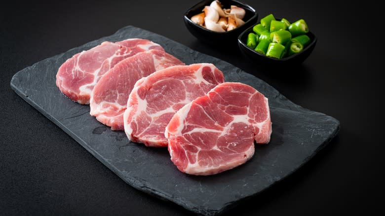 Raw pork slices on plate