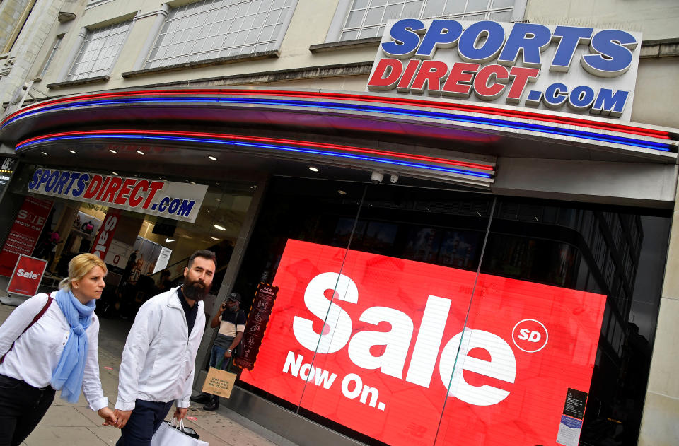 Shoppers walk past a branch of Sports Direct in Oxford Street, London, Britain, July 15, 2020. REUTERS/Toby Melville