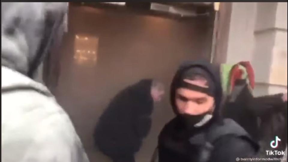 Michael St. Pierre of Fall River is seen here in a still frame from a TikTok video after he is seen apparently hurling an object into the building during the Capitol riot on Jan. 6, 2021, in Washington, D.C.