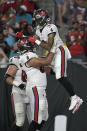 Tampa Bay Buccaneers wide receiver Jerreth Sterns (9) celebrates with offensive tackle Dylan Cook (65) after scoring against the Miami Dolphins during the second half of an NFL preseason football game Saturday, Aug. 13, 2022, in Tampa, Fla. (AP Photo/Phelan M. Ebenhack)