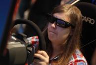 A visitor plays a Playstation during the Gamescom 2012 fair in Cologne August 16, 2012.