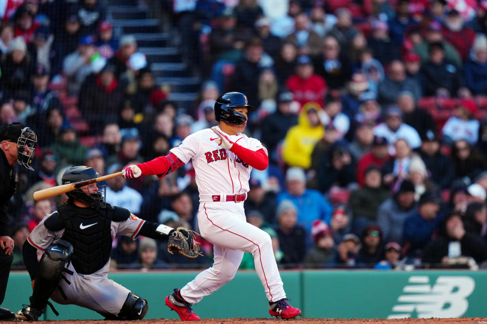 BOSTON, MA - MARCH 30:  Masataka Yoshida #7 of the Boston Red Sox hits a RBI single in the sixth inning during the game between the Baltimore Orioles and the Boston Red Sox at Fenway Park on Thursday, March 30, 2023 in Boston, Massachusetts. (Photo by Daniel Shirey/MLB Photos via Getty Images)