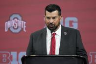 FILE - Ohio State head coach Ryan Day talks to reporters during an NCAA college football news conference at the Big Ten Conference media days, at Lucas Oil Stadium, Wednesday, July 27, 2022, in Indianapolis. Pay-for-play situations or improper inducements are still banned, but there is nothing stopping colleges from letting recruits know how athletes on campus are already profiting through NIL deals and how much support is available to them if they're interested. For instance, Ohio State has a Twitter account in which it boasted this summer that it had surpassed 1,000 disclosed NIL deals for its athletes. (AP Photo/Darron Cummings, File)