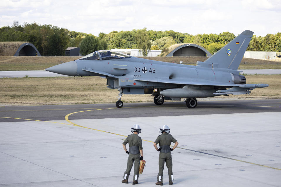 A German Eurofighter gets ready for takeoff at Neuburg Air Base in Neuburg An Der Donau, Germany, Monday Aug. 15, 2022. A group of German air force fighter jets neared Singapore on Tuesday, Aug. 16, 2022, in a marathon bid to fly them some 12,800 kilometers (8,000 miles) from their home base to Southeast Asia in just 24 hours. (Daniel Karmann/dpa via AP)