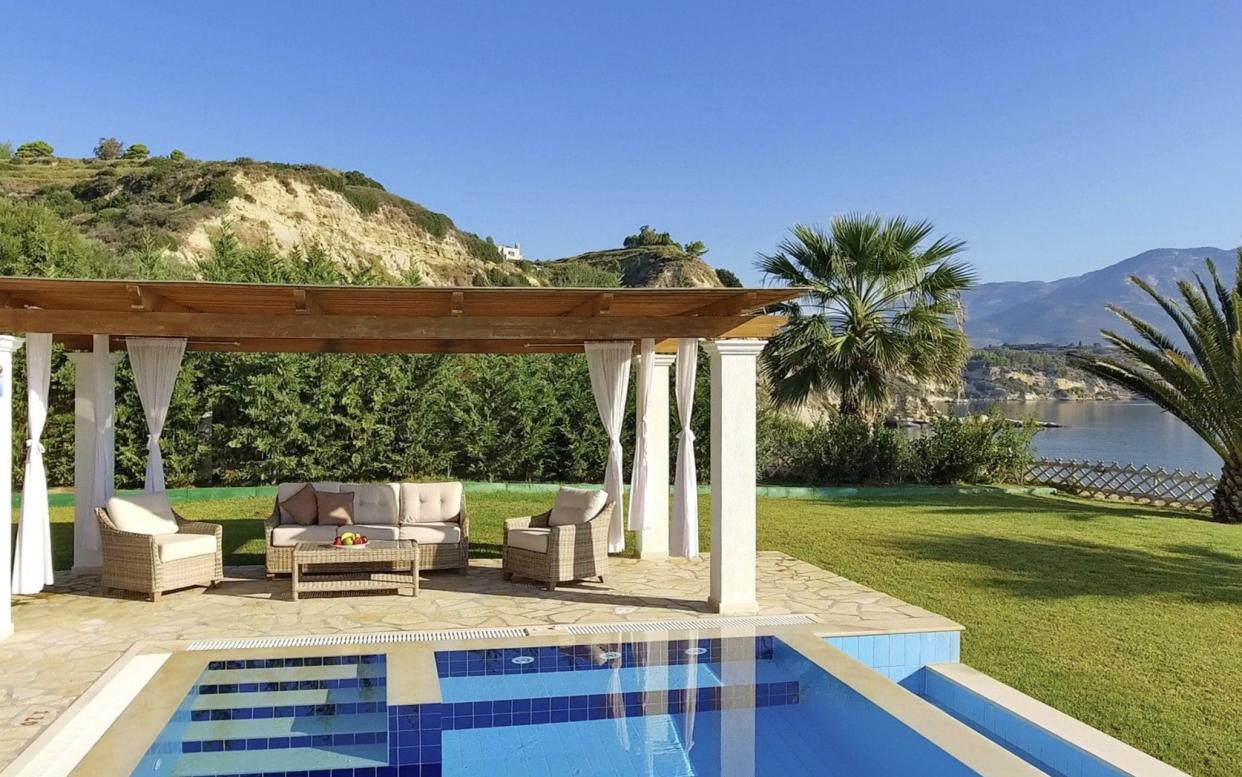 Shaded seating area next to an outdoor pool