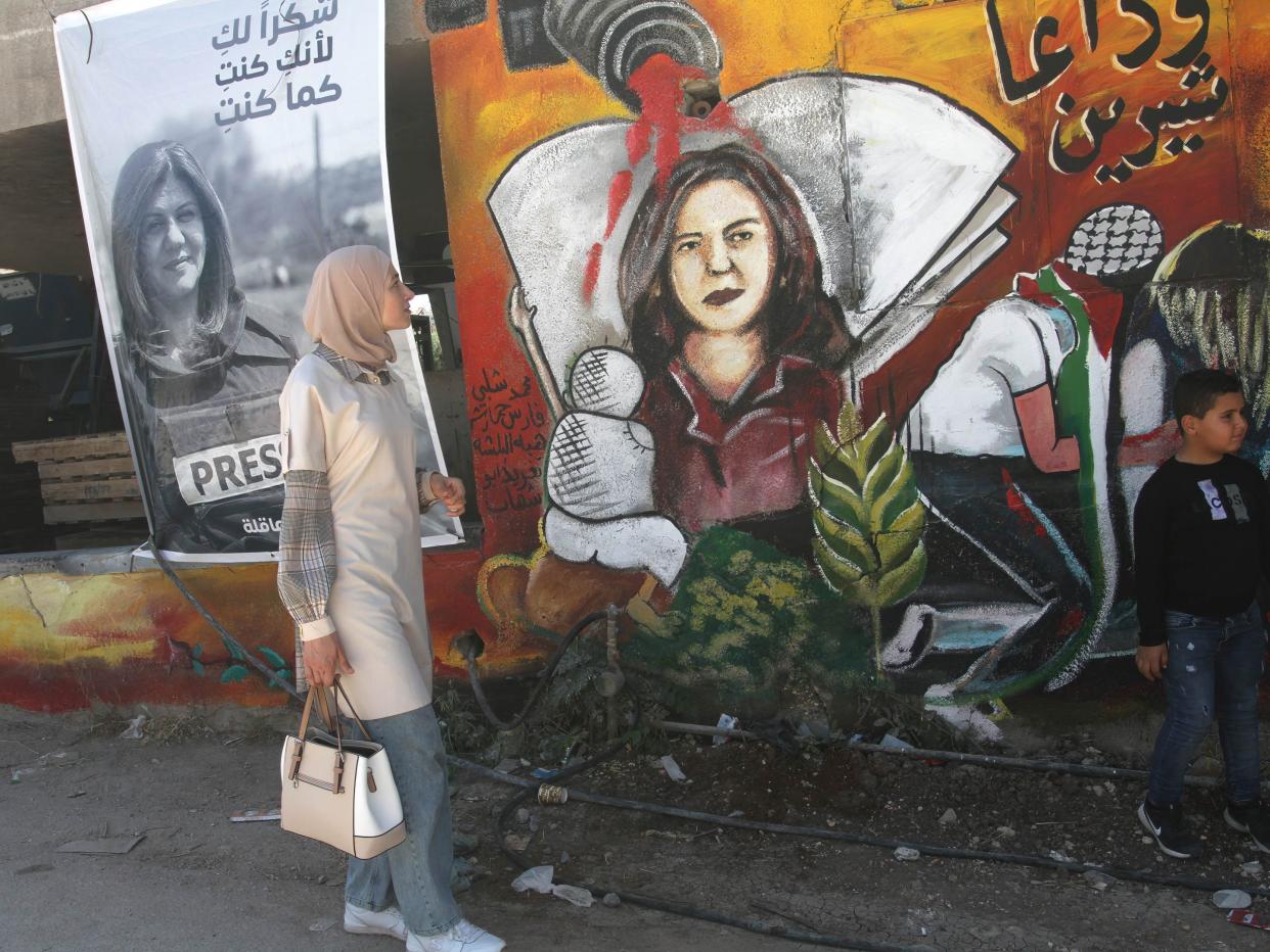 Palestinians visit the site where Al Jazeera correspondent Shireen Abu Akleh was killed in the city of Jenin in the occupied West Bank on May 18, 2022.
