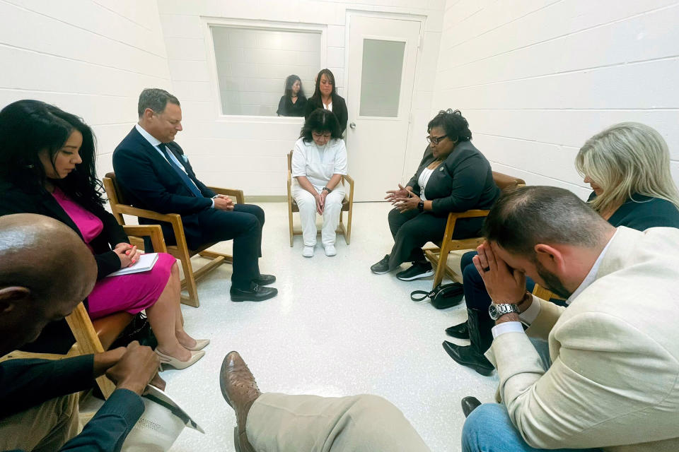 Melissa Lucio, center, leads a group of seven Texas lawmakers in prayer in a room at the Mountain View Unit in Gatesville, Texas, on April 6, 2022.<span class="copyright">Texas state Rep. Jeff Leach/AP</span>