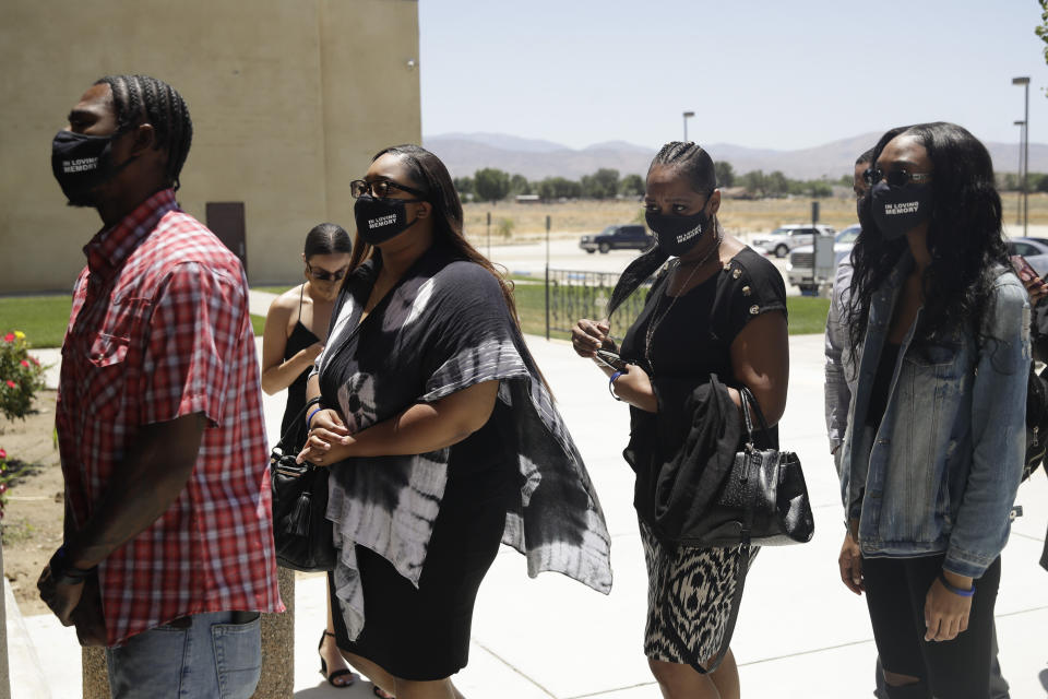 Friends and family arrive during a funeral for Robert Fuller Tuesday, June 30, 2020, in Littlerock, Calif. Fuller, a 24-year-old Black man was found hanging from a tree in a park in a Southern California high desert city. Authorities initially said the death of Fuller appeared to be a suicide but protests led to further investigation, which continues. (AP Photo/Marcio Jose Sanchez)