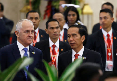 Australia Prime Minister Malcolm Turnbull (L) walks with Indonesia President Joko Widodo during Indian Ocean Rim Association (IORA) Leaders' Summit 2017 in Jakarta, Indonesia, March 7, 2017. REUTERS/Beawiharta
