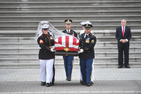 The casket of Senator John McCain, R-Ariz., is carried down the steps of the U.S. Capitol in Washington, U.S. September 1, 2018. Marvin Joseph/Pool via REUTERS