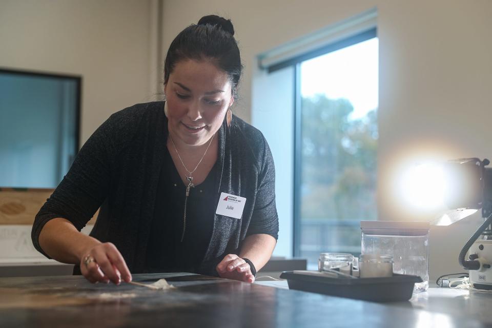 Paintings conservator Julie Ribits works to conserve peeling paint on a mid-17th century piece at the renovated Eskenazi Museum of Art at Indiana University in Bloomington, Ind., seen on Monday, Nov. 4, 2019. The $30 million renovation is the first since the I.M. Pei-designed museum was constructed in 1982.