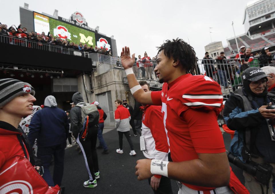 Ohio State Buckeyes quarterback C.J. Stroud (7) waves to fans as he leaves the field following their 56-7 win over the Michigan State Spartans in the NCAA football game at Ohio Stadium in Columbus on Saturday, Nov. 20, 2021. 