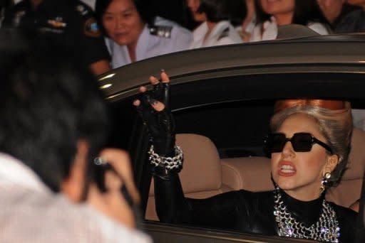 Pop superstar Lady Gaga waves to fans in Bangkok on May 23. Lady Gaga would rather cancel dates in her world tour than make changes to appease censors and religious groups, the US singer's manager said Thursday as controversy dogs her in Asia