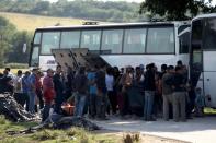 Thousands of migrants are being bussed to newly opened camps near Greece's second city Thessaloniki