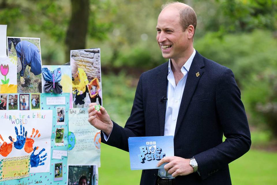 <p>Andrew Parsons / Kensington Palace</p> Prince William with his green Blue Peter badge 