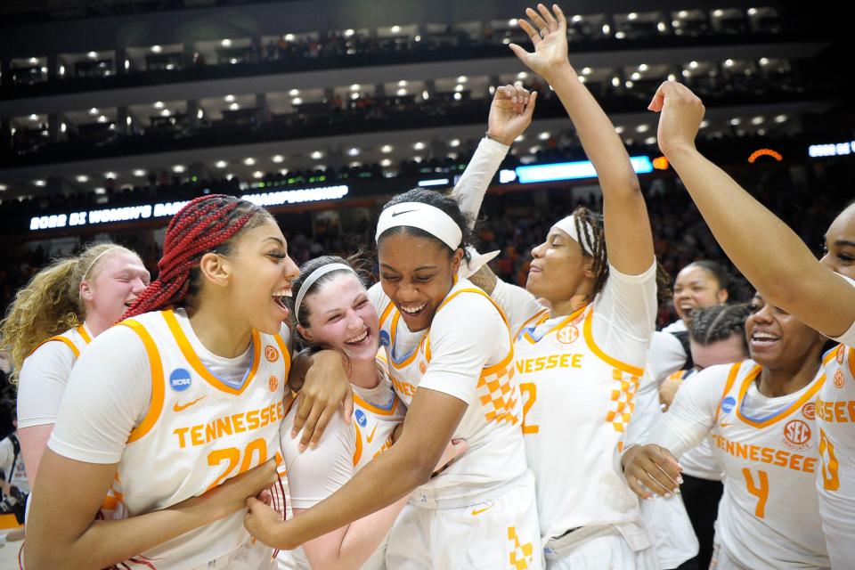Tennessee center Tamari Key (20), guard/forward Sara Puckett (1) and guard Kaiya Wynn (5) and forward Alexus Dye (2) and teammates celebrate after defeating Belmont  70-67 during a second round NCAA Division I Women's Basketball Championship game at Thompson-Boling Arena in Knoxville, Tenn. on Monday, March 21, 2022.