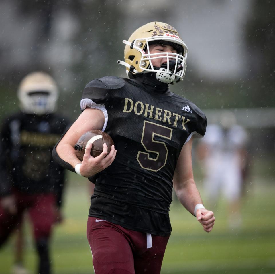Doherty's Patrick Dowd, shown here running toward a touchdown, has posted fine defensive numbers.