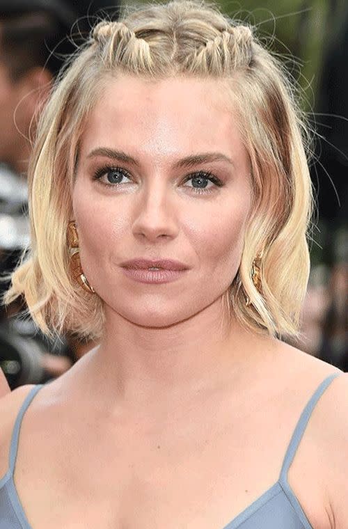 Miller looked adorable with her braided back hairpieces, nude pout and neutral shadow at the closing ceremony and <i>Le Glace Et Le Ciel (Ice And The Sky)</i> premiere during the 68th annual Cannes film festival.