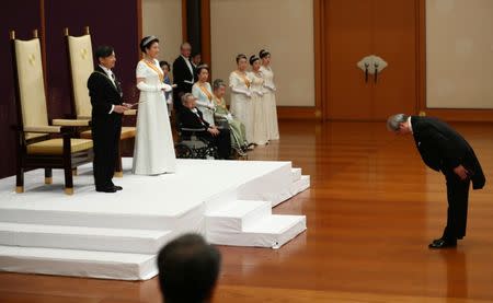 Japan's Emperor Naruhito, flanked by Empress Masako, attends a ceremony called Sokui-go-Choken-no-gi, his first audience after the accession to the throne , at the Imperial Palace in Tokyo, May 1, 2019. Japan Pool/Pool via REUTERS