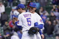 Chicago Cubs' Matt Duffy (5) and Anthony Rizzo celebrate their win over the Pittsburgh Pirates after a baseball game Friday, May 7, 2021, in Chicago. (AP Photo/Charles Rex Arbogast)