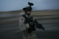 <p>A U.S. soldier with the 1st Brigade, 25th Infantry Division walks the streets during a dusk patrol on January 18, 2005, in Tal Afar, Iraq. During the patrol the soldiers fired on a car when it failed to stop and came toward soldiers, despite warning shots beign fired. The car held an Iraqi family of which the mother and father were killed. According to the U.S. Army, six children in the in the car survived, one with a non-life threatening flesh wound. U.S. military said they are is investigating the incident. (Photo by Chris Hondros/Getty Images) </p>