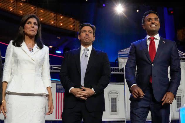 Former U.N. Ambassador Nikki Haley, Florida Gov. Ron DeSantis (center) and businessman Vivek Ramaswamy before the start of Wednesday's GOP presidential debate.