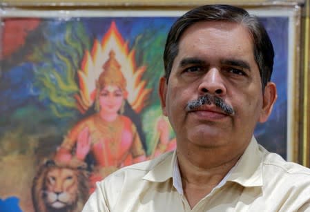 Ashwani Mahajan, chief of the Hindu nationalist Rashtriya Swayamsevak Sangh's (RSS) economic group Swadeshi Jagran Manch (SJM), poses for a photograph inside his office in New Delhi