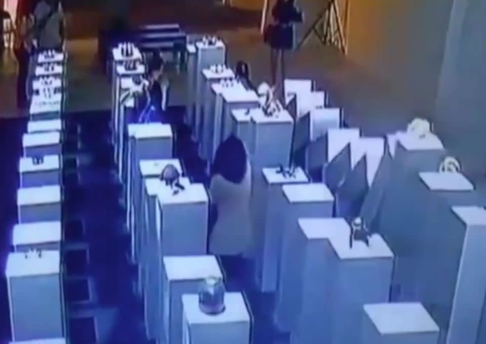 An LA gallery has denied a costly viral mishap was a publicity stunt, where CCTV shows a woman creating a domino effect of expensive artwork. Picture: YouTube