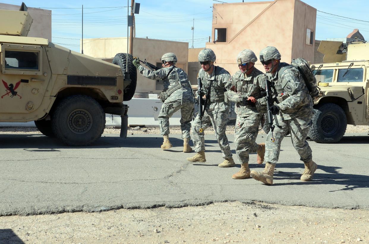 Soldiers participate in an urban patrol training scenario in Ujen, one of the training cities at the Fort Irwin National Training Center in 2016.