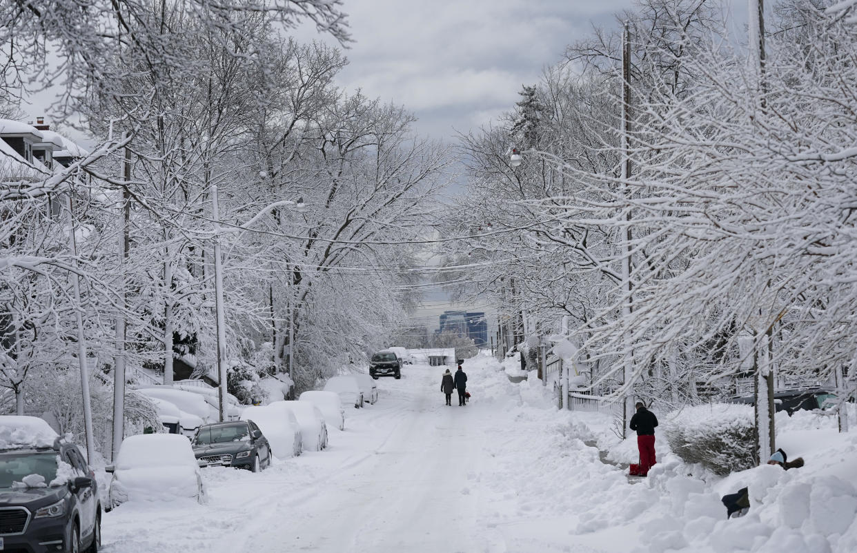 A snow covered street is seen following a snow storm in Toronto on Saturday, March 4, 2023. Environment Canada has issued a winter storm warning for much of southern Ontario. (Arlyn McAdorey/The Canadian Press)