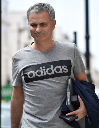 Jose Mourinho walks towards his house in London, Britain May 27, 2016. REUTERS/Toby Melville