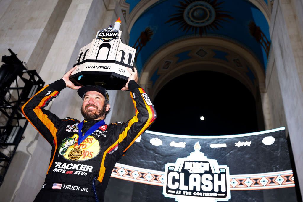 los angeles, california february 05 martin truex jr, driver of the 19 bass pro shops toyota, celebrates with the nascar clash at the coliseum trophy in victory lane after winning the nascar clash at the coliseum at los angeles memorial coliseum on february 05, 2023 in los angeles, california photo by jared c tiltongetty images