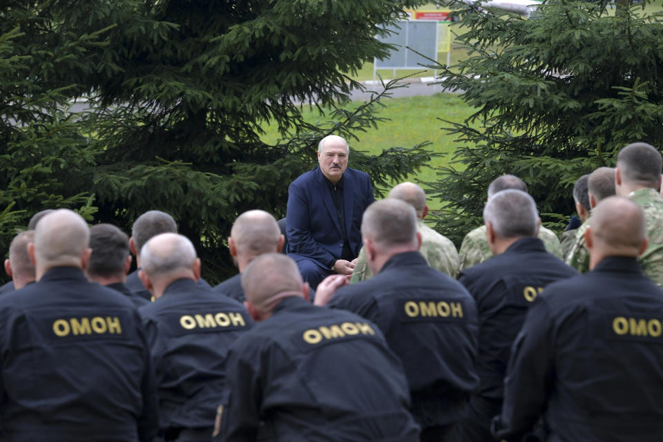 FILE - In this Aug. 21, 2020, file photo, Belarusian President Alexander Lukashenko speaks during a meeting with the leadership of power structures and law enforcement in Minsk, Belarus. Police used tear gas, flash grenades and beatings in a harsh crackdown on protesters denouncing the Aug. 9 election that kept Lukashenko in power. But now he is moving to squelch the demonstrations gradually with vague promises of reforms mixed with threats, court summonses and the selective jailing of leading activists. (Andrei Stasevich/Pool Photo via AP, File)