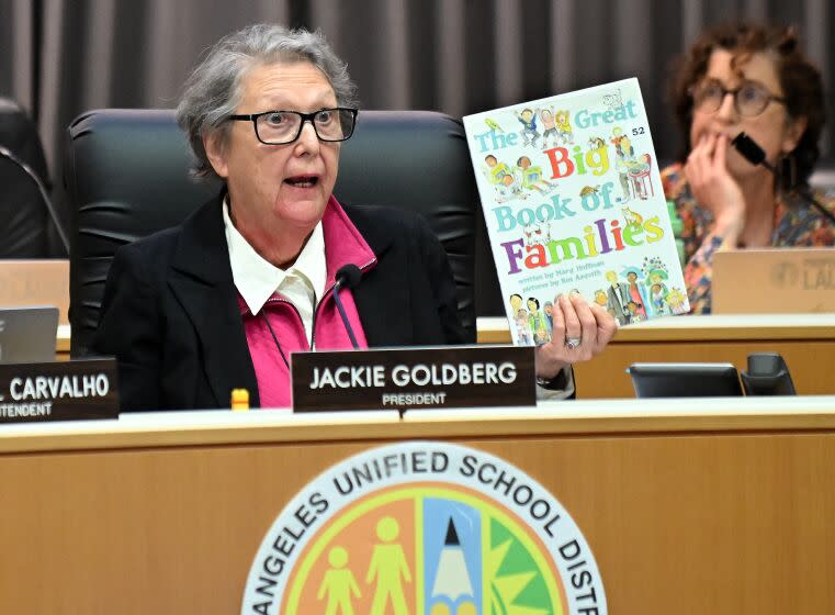 Los Angeles, California June 6, 2023-LAUSD school board member Jackie Goldberg holds up a book 'The Great Big Book of Famialies' during a board meeting in Los Angeles Tuesday. (Wally Skalij/Los Angeles Times)