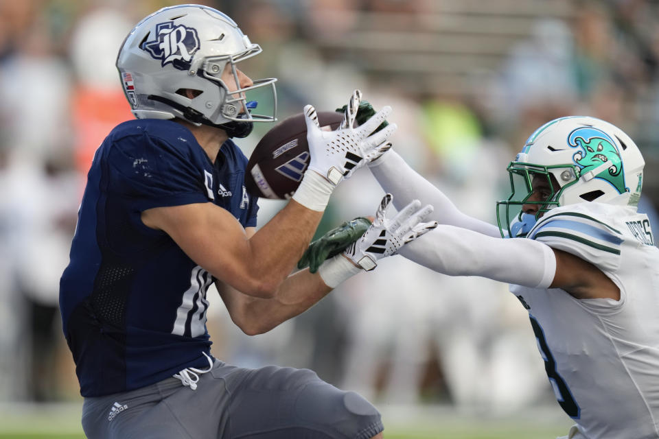 Rice wide receiver Luke McCaffrey, left, catches a pass for a touchdown as Tulane safety Kam Pedescleaux defends during the second half of an NCAA college football game, Saturday, Oct. 28, 2023, in Houston. (AP Photo/Eric Christian Smith)