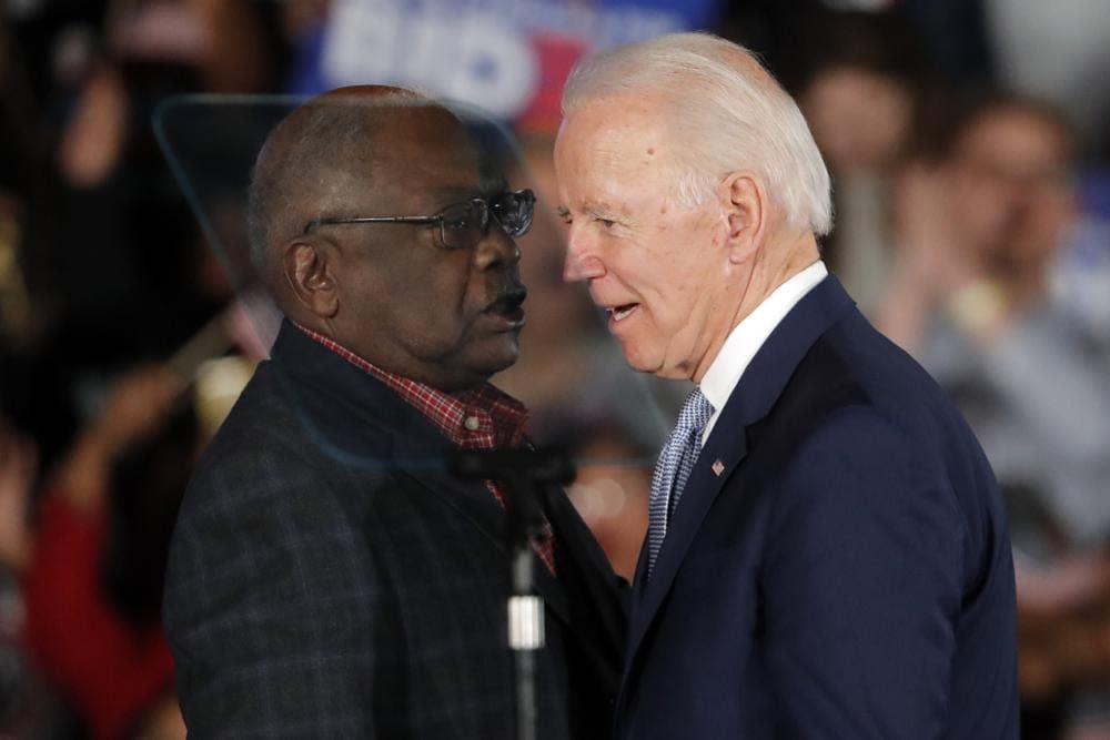 Then-Democratic presidential candidate Joe Biden talks to Rep. James Clyburn, D-S.C., at a primary night election rally in Columbia, S.C., Feb. 29, 2020 after winning the South Carolina primary. (AP Photo/Gerald Herbert)