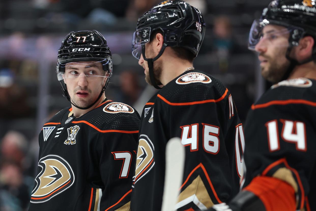 ANAHEIM, CALIFORNIA - JANUARY 05: Frank Vatrano #77, Ilya Lyubushkin #46, and Adam Henrique #14 of the Anaheim Ducks look on during the third period of a game against the Winnipeg Jets at Honda Center on January 05, 2024 in Anaheim, California.