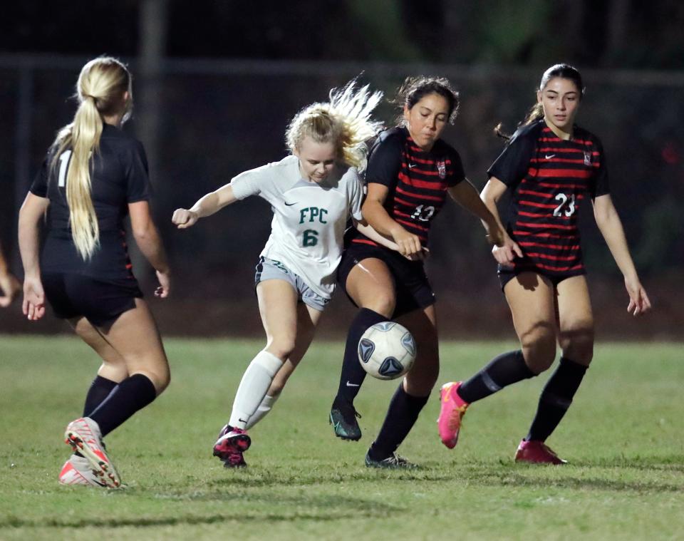 New Smyrna Graciela Guzman (13) battles with Flagler Palm Coast's Katherine Ouellette (6) during a match at Ormond Sports Complex, Tuesday, Jan. 16, 2024.