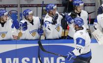 Finland's Joni Nikko (11) celebrates his goal against Canada with teammates during the second period of their IIHF World Junior Championship ice hockey game in Malmo, Sweden, January 4, 2014. REUTERS/Alexander Demianchuk (SWEDEN - Tags: SPORT ICE HOCKEY)