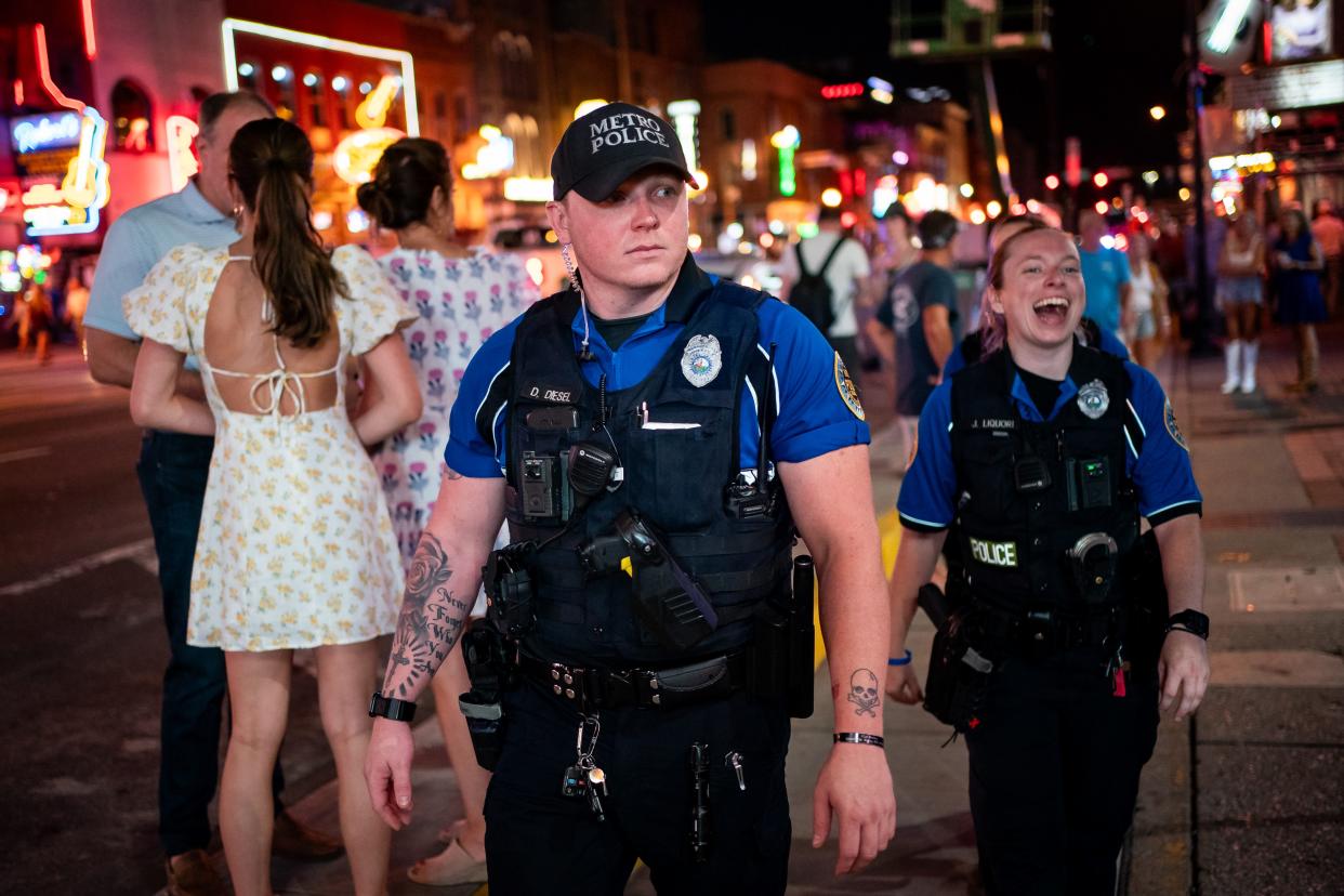 Metro Nashville Police officers Dennis Diesel and Jennifer Liquori, of the Entertainment District Unit, patrol on Lower Broadway in Nashville, Tenn., Thursday, July 13, 2023. MNPD’s Entertainment District Unit works Thursday through Sunday night patrolling Lower Broadway, the Gulch, and neighboring areas.