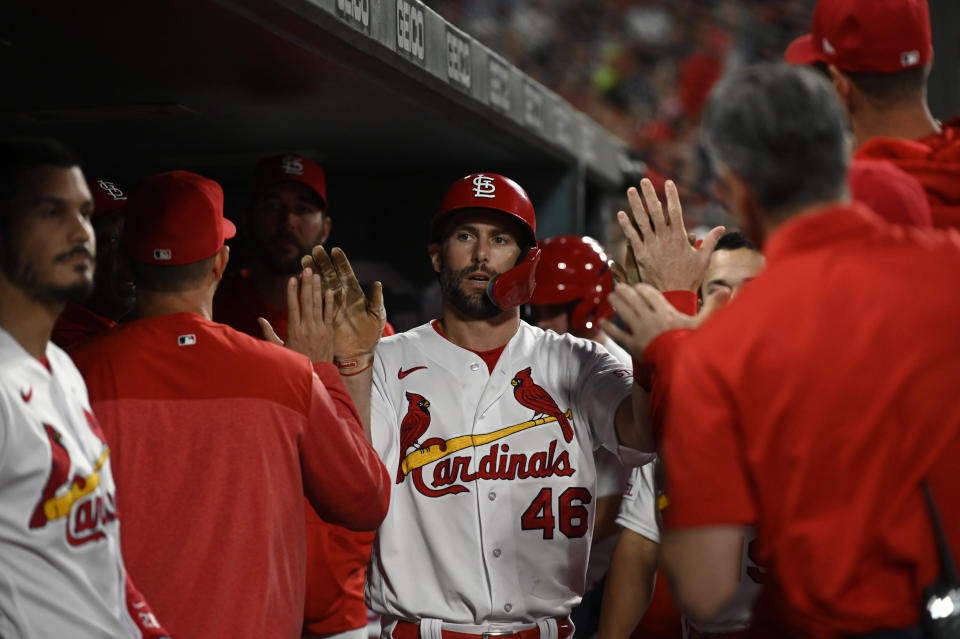 St. Louis Cardinals' Paul Goldschmidt, center, is congratulated by teammates after scoring against the Detroit Tigers during the fourth inning of a baseball game Friday, May 5, 2023, in St. Louis. (AP Photo/Jeff Le)