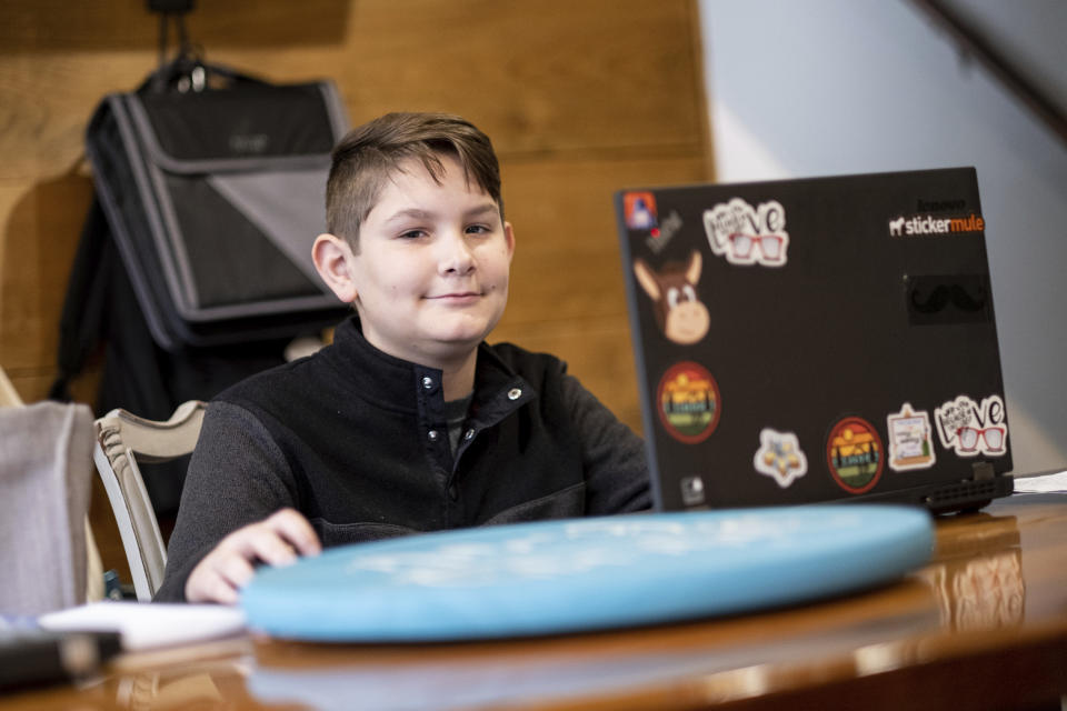 Tate Rivera is photographed at his home in Roswell, Ga., Friday, Feb. 12, 2021. Kelli Rivera is hoping a voucher bill passes that will help pay for her to move her son out of a public Cobb County school and into a private school. (AP Photo/Ben Gray)