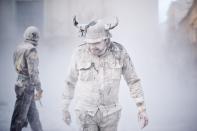 IBI, SPAIN - DECEMBER 28: A Reveler takes part in the battle of 'Enfarinats', a flour fight in celebration of the Els Enfarinats festival on December 28, 2012 in Ibi, Spain. Citizens of Ibi annually celebrate the festival with a battle using flour, eggs and firecrackers. The battle takes place between two groups, a group of married men called 'Els Enfarinats' which take the control of the village for one day pronouncing a whole of ridiculous laws and fining the citizens that infringe them and a group called 'La Oposicio' which try to restore order. At the end of the day the money collected from the fines is donated to charitable causes in the village. The festival has been celebrated since 1981 after the town of Ibi recovered the tradition but the origins remain unknown. (Photo by David Ramos/Getty Images)